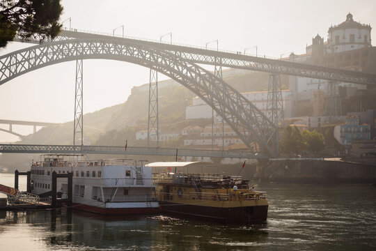 Early morning mist on the Douro river docks in Porto - Powered by Adobe