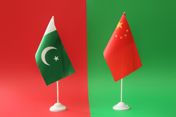 Flags of China and Pakistan on color background