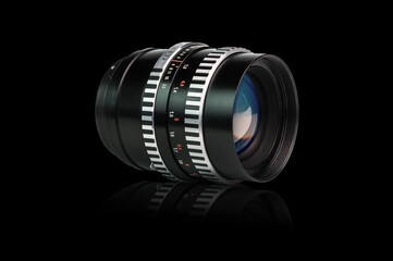 isolated old photo lens on black background with reflection