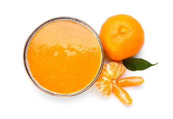 Bowl of tasty tangerine jam on white background