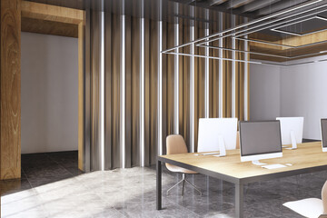 Contemporary spacious concrete and wooden coworking office interior with table, computer monitors and other items. Law, legal and commercial concept. 3D Rendering.