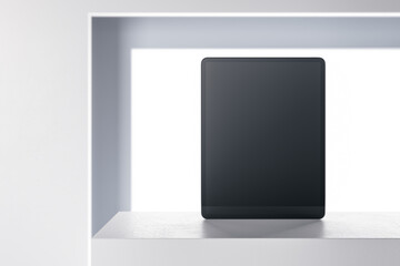 Close up of creative white product stand with empty black tablet. Retail and technology concept. Mock up, 3D Rendering.