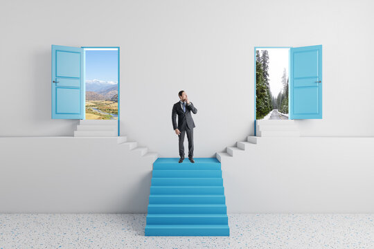 Businessman standing on abstract blue staircase with two open doors in concrete interior. Success, way and opportunity concept.
