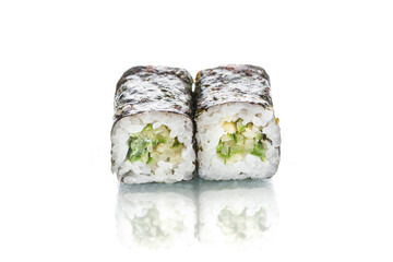 Two pieces of Japanese Vegetarian Maki sushi roll with nori seaweed on top. Cucumber inside roll. Side view of asian veggie roll isolated on white background. Copy space menu image with reflection 
