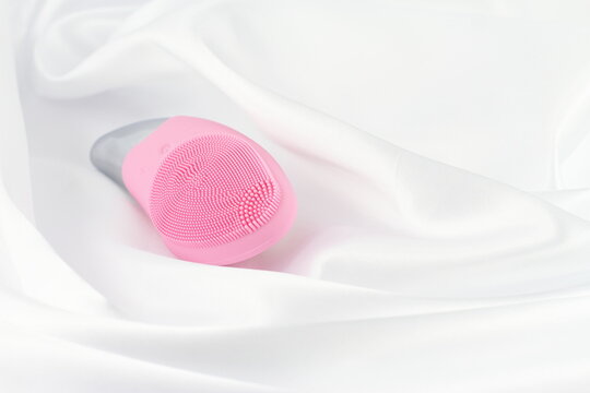 Pink Facial Sonic Brush On White Silk 