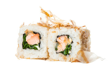 Two pieces of Japanese inside out sushi roll with roasted salmon, spring onion inside and tuna chips bonito. Asian dish isolated on white background. Single object. Copy space
