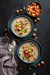 Homemade mushrooms soup with champignons, herbs and cream.