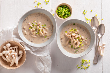 Creamy shimeji mushroom soup with cream and chives.