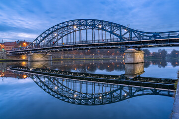 Pilsudski steel truss bridge over Vistula river in Krakow in the blue hour