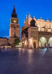 Main market square in Krakow, Poland, Cloth Hall and Town Hall tower in the evening