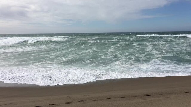 Handheld Iphone Low View Of Northern California Waves On Beach Cloudy Sky
