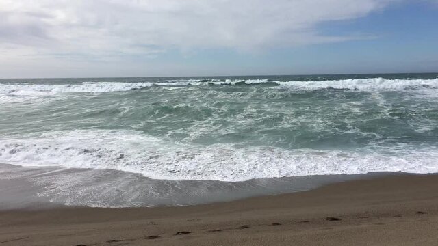 Handheld Iphone Low View Of Northern California Waves On Beach Cloudy Sky
