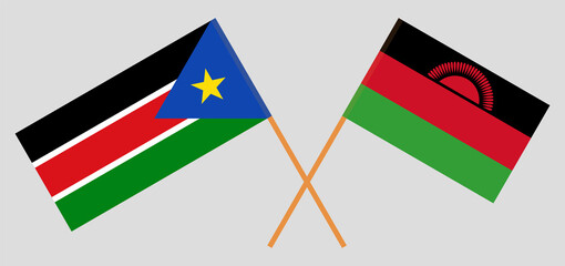 Crossed flags of South Sudan and Malawi. Official colors. Correct proportion