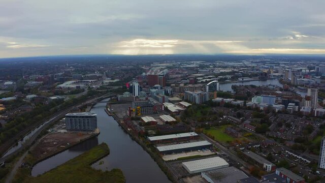 Aerial view of Manchester city in UK on a beautiful cloudy day.