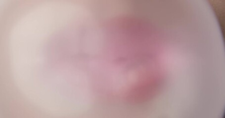 Female with Red Lips Blowing Big Bubble with a Bubble Gum Filling Whole Frame and Bursting 
