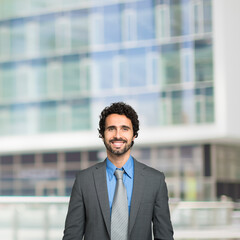 Smiling business man, businessman with large copy-space