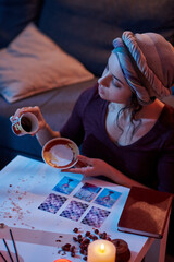 Focused fortune-teller starting the coffee reading procedure
