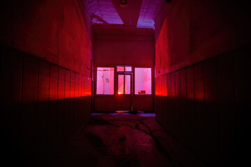 Dark and creepy corridor of old abandoned mental hospital at night