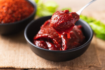 Korean gochujang (red chili paste), spicy and sweet fermented condiment in Korean food - obrazy, fototapety, plakaty