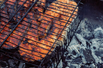 cooking fish outdoors barbecue close-up charcoal meal