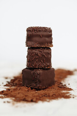 Dark Chocolate Petit Four Cakes Stack on Cocoa and Sprinkles Valentine's Day Dessert