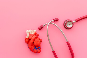 Cardioigy disease treatment - heart model with stethoscope top view