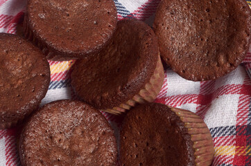 Delicious chocolate cupcakes with baking cloth