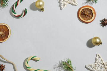 Christmas background. Frame made of Christmas decorations on gray canvas backdrop. Copy space. Christmas concept. 