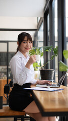 Excited african asia woman sit at desk feel euphoric win online lottery, happy black woman...
