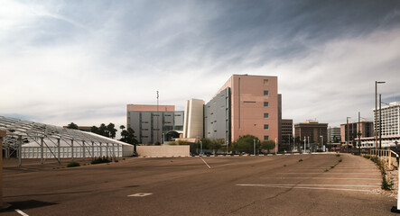 Fototapeta na wymiar Generic office buildings and empty parking lot in American city.