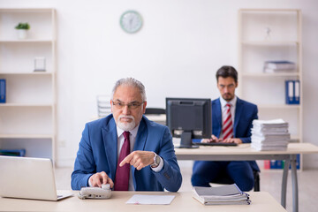 Two male colleagues working in the office