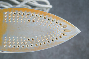 electric iron on a grey background