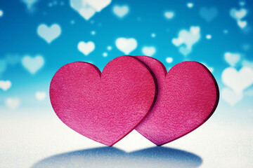 Two red gift boxes with blurred white heart symbol