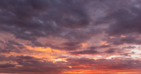 Beautiful sunset sky above clouds with dramatic light
