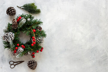 Fototapeta na wymiar Christmas wreath with with fir tree, ribbon and decor. New year decoration