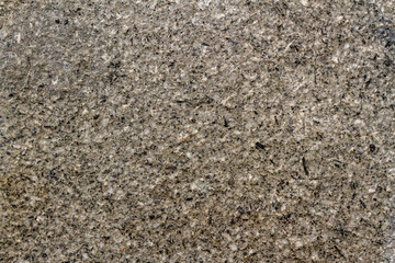 Walls from a mixture of stone and cement as reinforcement for sidewalks and building walls, abstract/texture for the background