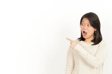 Pointing aside and Showing Product of Beautiful Asian Woman Isolated On White Background