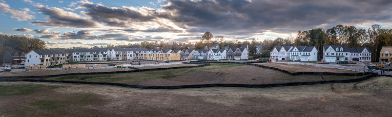Naklejka premium New neighborhood town homes and empty lots under construction in Columbia Maryland USA