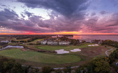 Aerial sunset view of a resort with a golf course near the Chesapeake in Cambridge Maryland with...