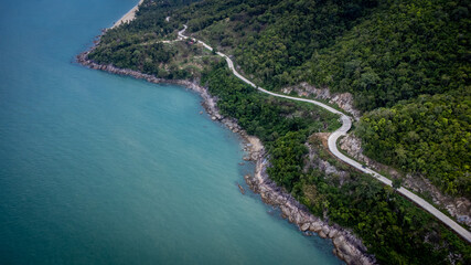 Ocean Road and sand beach in Khanom Sichon Road at Khao Phlai Dam ,Nakorn Sri Thammarat province, Thailand. Shot by Drone Aerial View