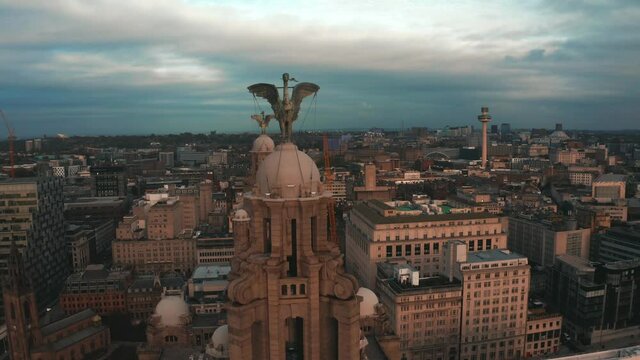 Aerial close up view of the tower of the Royal Liver Building in Liverpool, UK during beautiful sunset.
