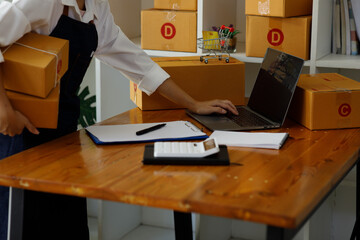 Starting small businesses SME owners female entrepreneurs Write the address on receipt box and check online orders to prepare to pack the boxes, sell to customers, sme business ideas online.