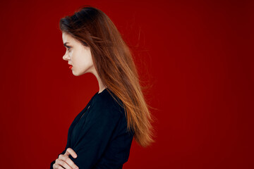 Fototapeta premium pretty woman with red lips red hair Glamor posing red background