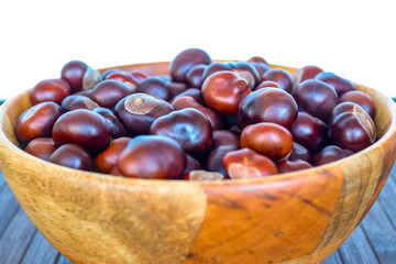 Close-up to chestnuts in a wooden bowl