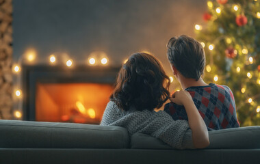 couple relaxing near Christmas tree