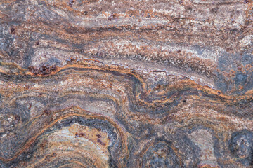 grunge background: curly rust on an old metal surface, toning