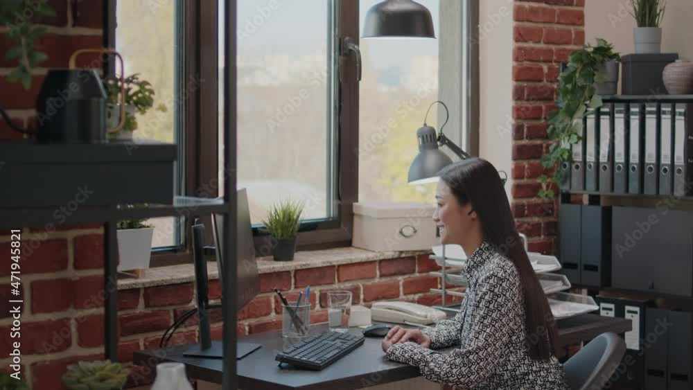 Poster entrepreneur using video call on computer for communication, talking to colleague about business pro