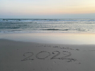 2022 year letter on sunset beach background