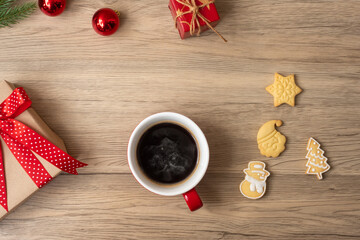 Merry Christmas with homemade cookies and coffee cup on wood table background. Xmas eve, party, holiday and happy New Year concept