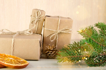 Gifts wrapped in kraft paper, tied with twine
